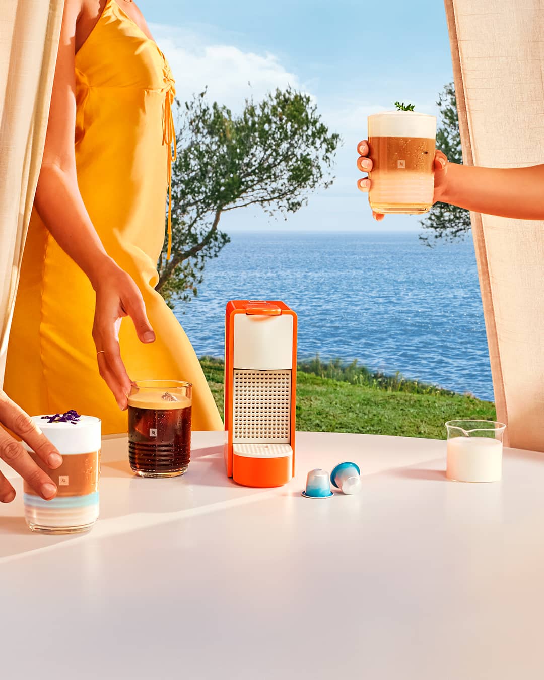 Nespresso Limited Edition Essenza Mini in Mandarin Orange, Freddo Delicato, and Freddo Intenso